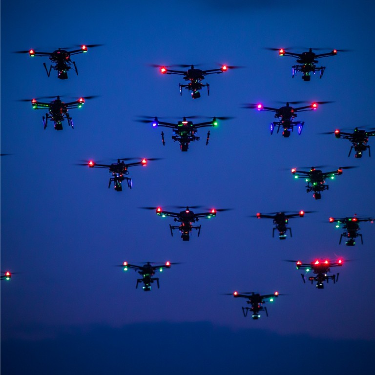 group-drones-flying-formation-light-show-synchronized-display (Medium)